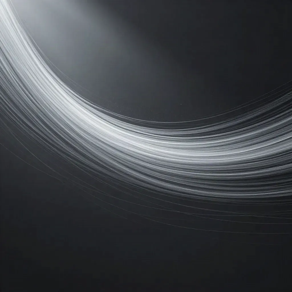 Silver filaments converge into a soft white bloom in dark graphite haze with empty copy space.